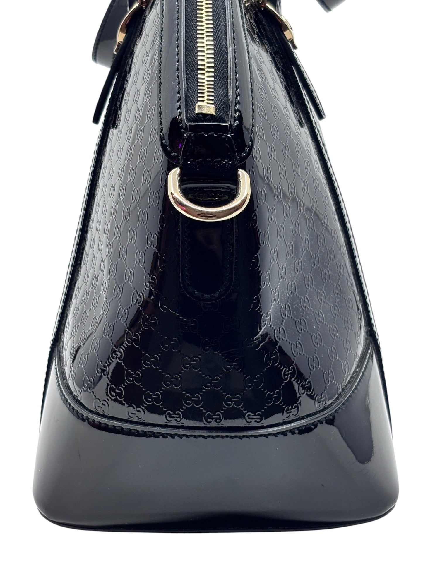 Posh Purse Co black Gucci Micro Guccissima leather handbag featuring the iconic embossed GG pattern and gold hardware.