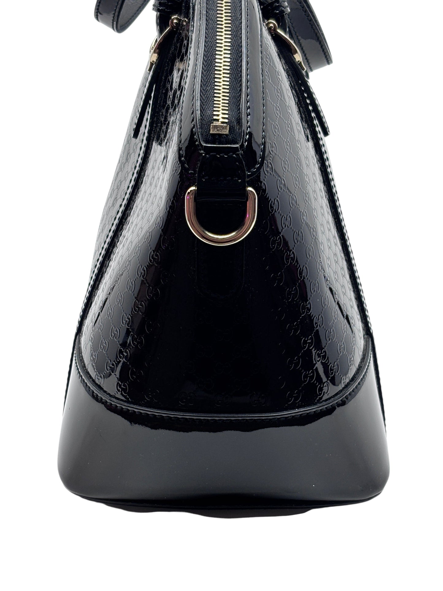 Posh Purse Co black Gucci Micro Guccissima leather handbag with embossed GG pattern and gold-tone hardware side view