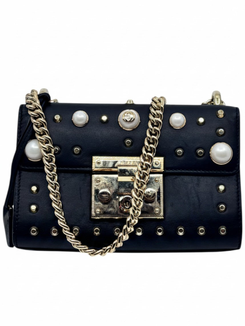 Posh Purse Co black Gucci shoulder bag with gold-tone chain strap, pearl embellishments, and metal stud detailing.
