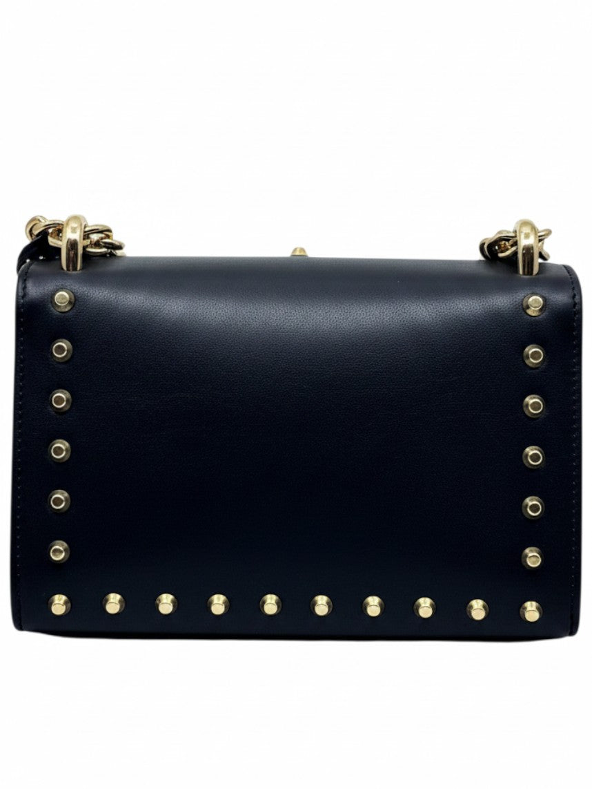 Posh Purse Co black Gucci shoulder bag featuring gold-tone stud hardware and pearl embellishments on a leather body.