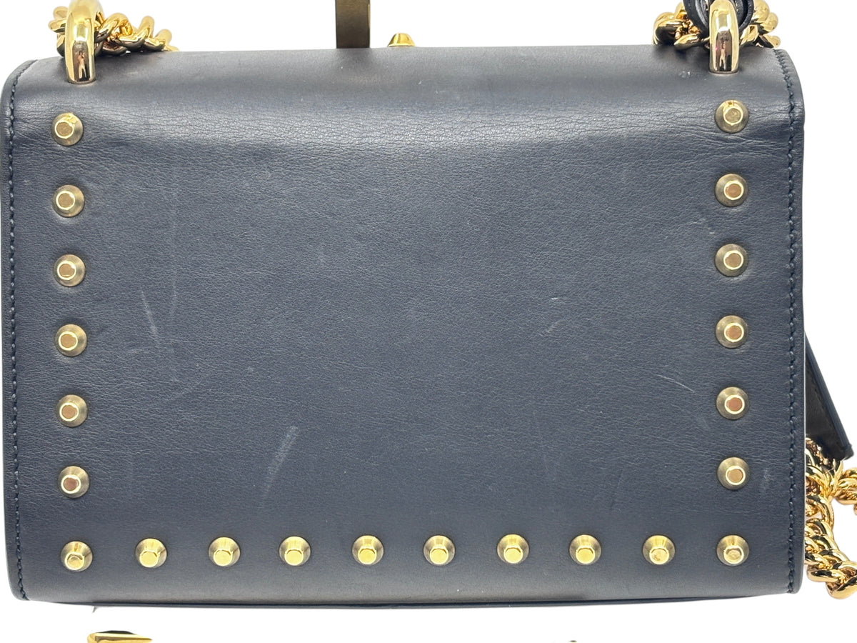 Posh Purse Co black Gucci shoulder bag featuring gold-tone stud embellishments and a gold chain strap
