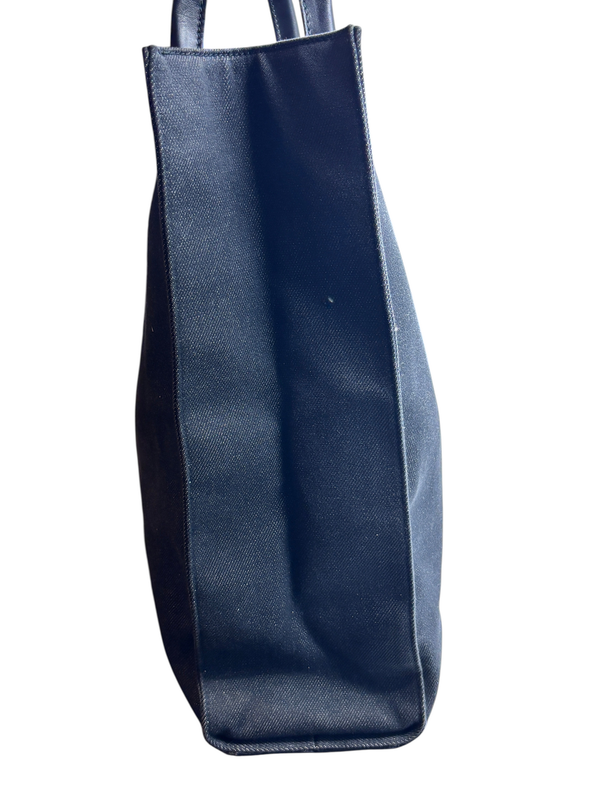 Side view of a black vintage Gucci shopper tote bag from Posh Purse Co. featuring a structured canvas silhouette.