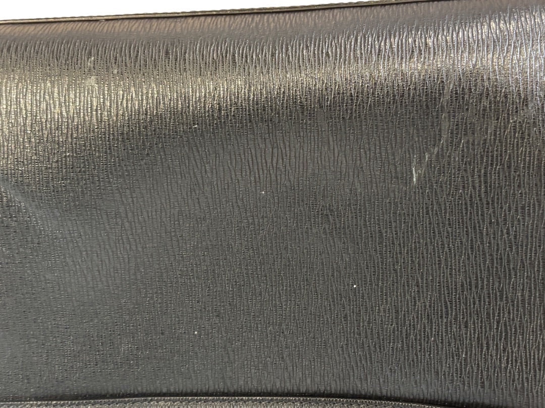 Posh Purse Co black textured leather Mancini Revival briefcase with subtle surface marks.