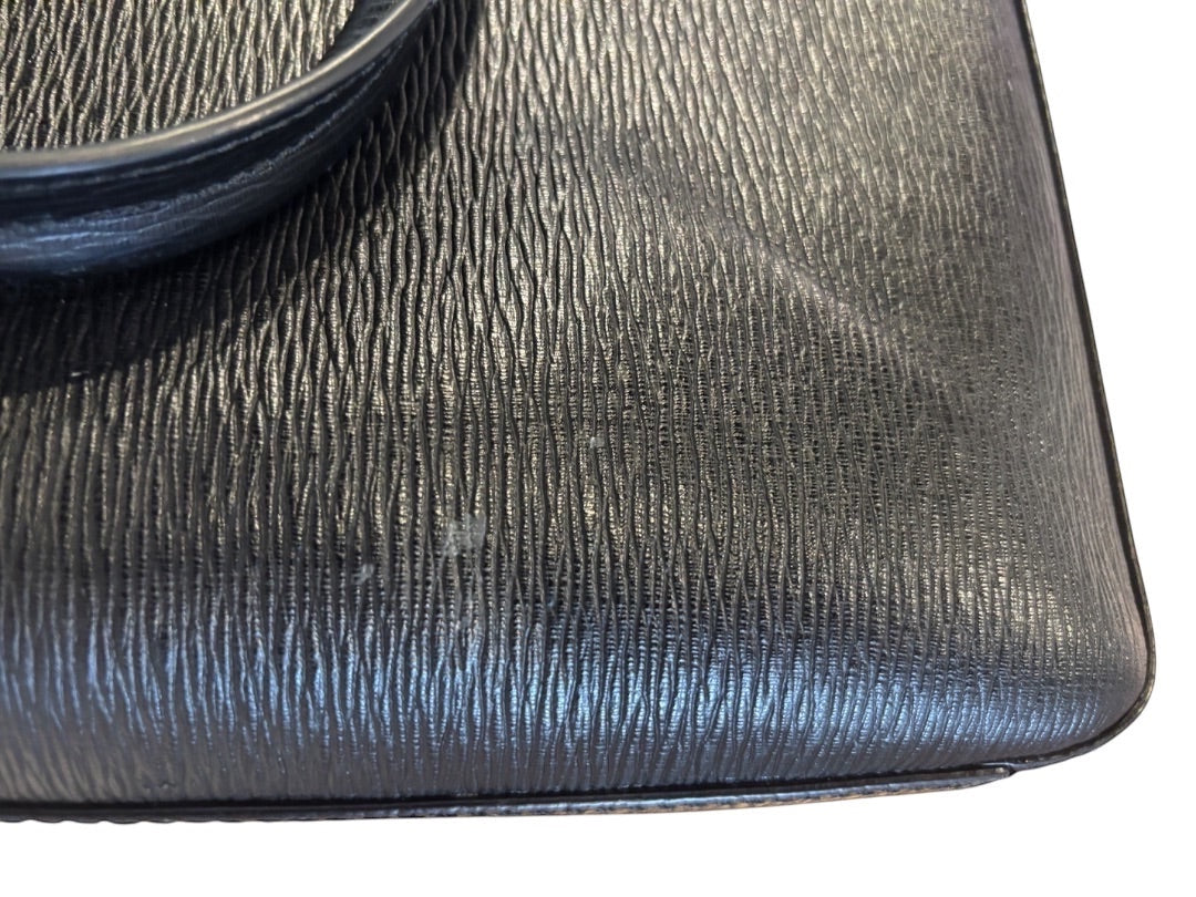 Posh Purse Co black textured leather Mancini Revival briefcase with top handle and subtle scuff marks.