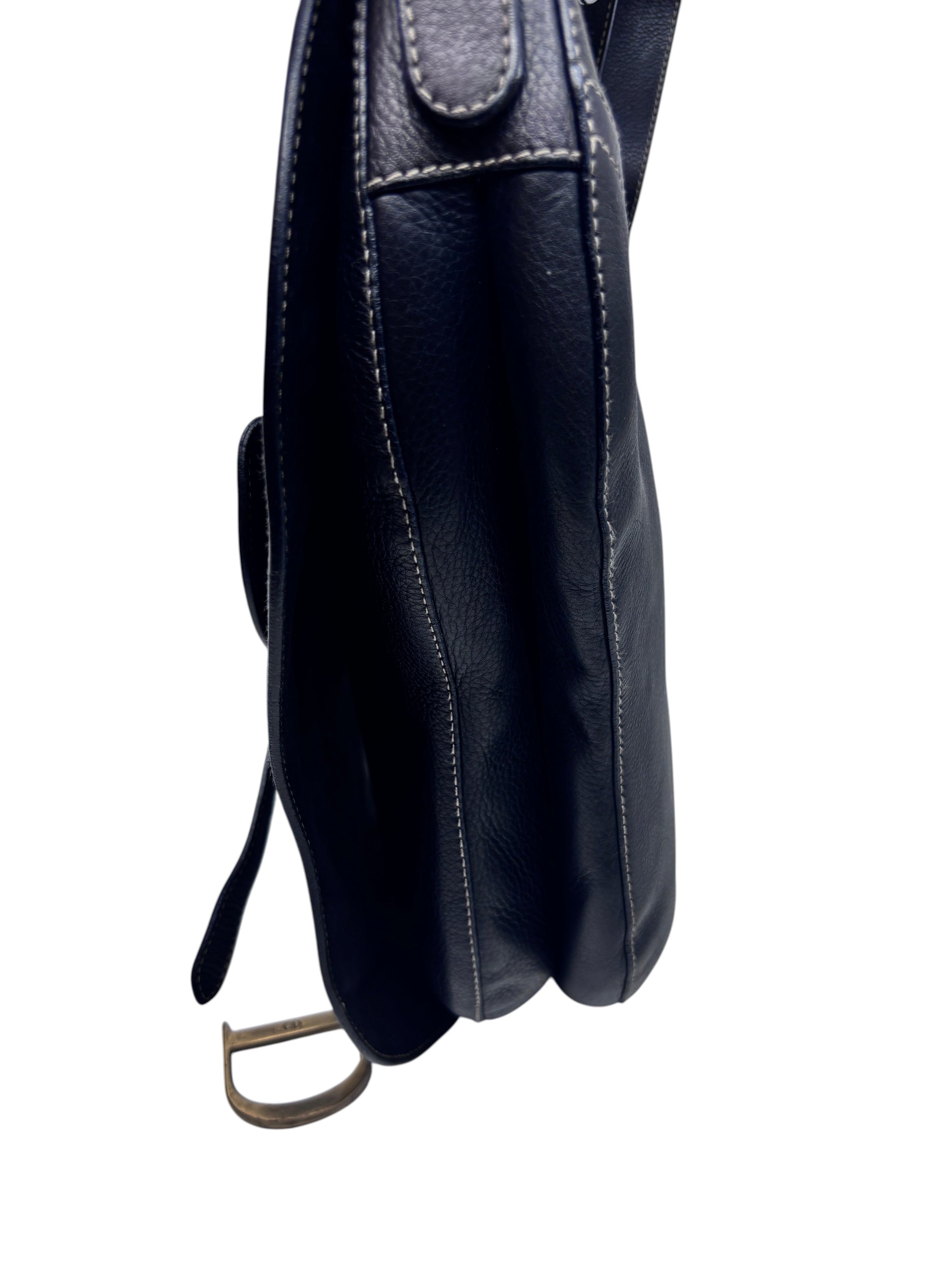 Side view of a black leather Dior Baudrier Saddle Bag with contrast stitching, sold by Posh Purse Co.