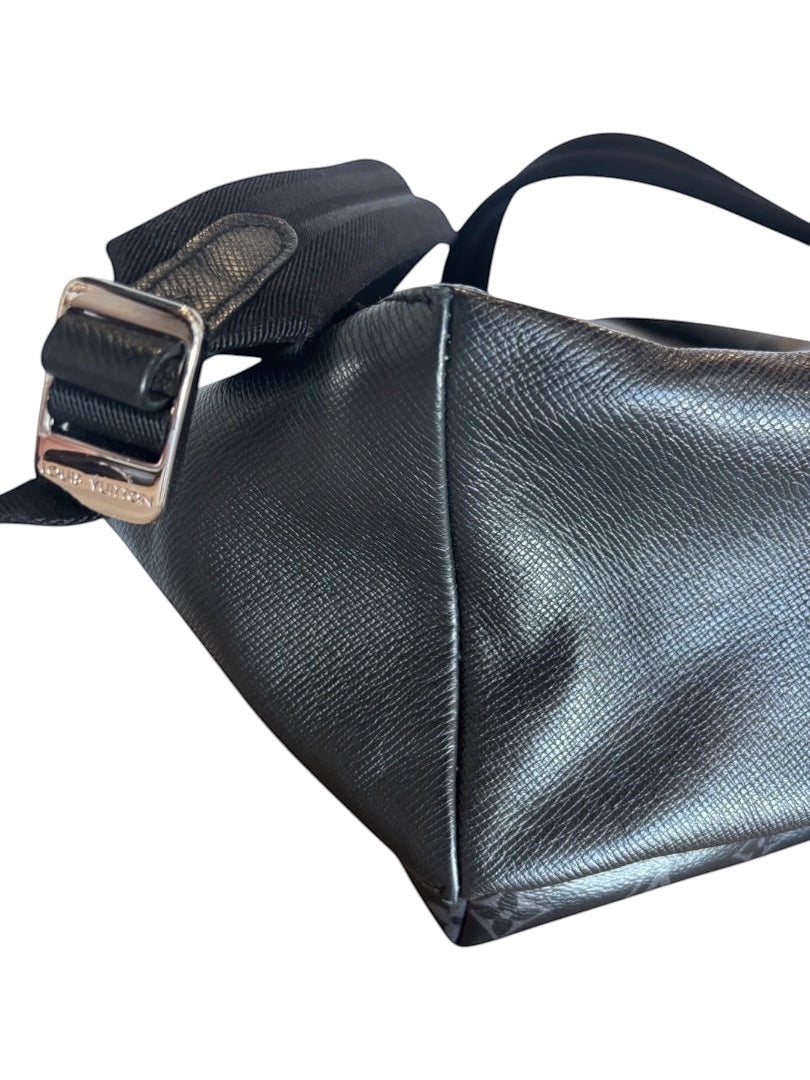 Posh Purse Co black Louis Vuitton Discovery backpack in coated canvas with silver-tone hardware and adjustable shoulder strap.