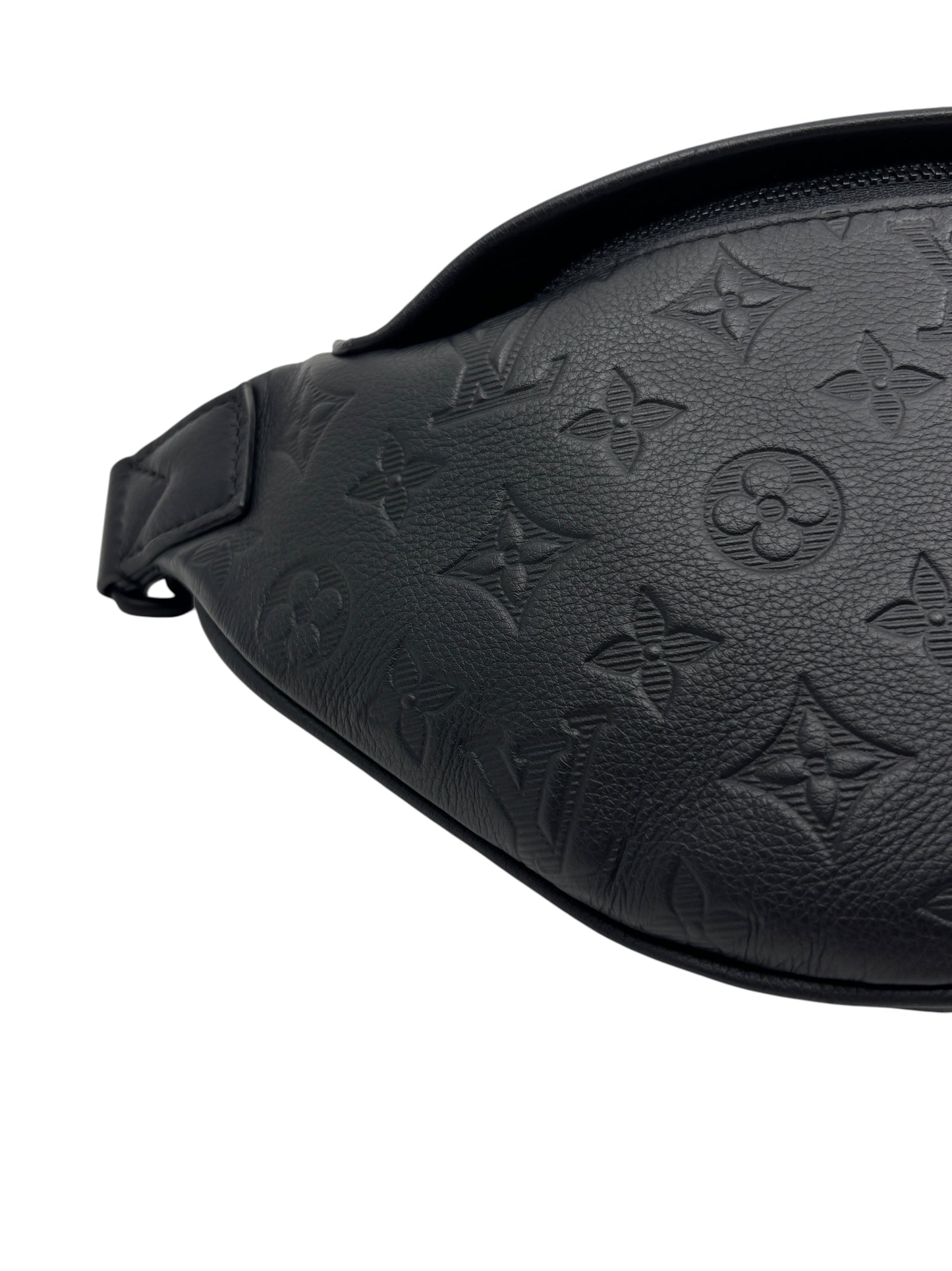 Posh Purse Co. black Louis Vuitton Discovery Bumbag in embossed Monogram Empreinte leather with a textured finish.