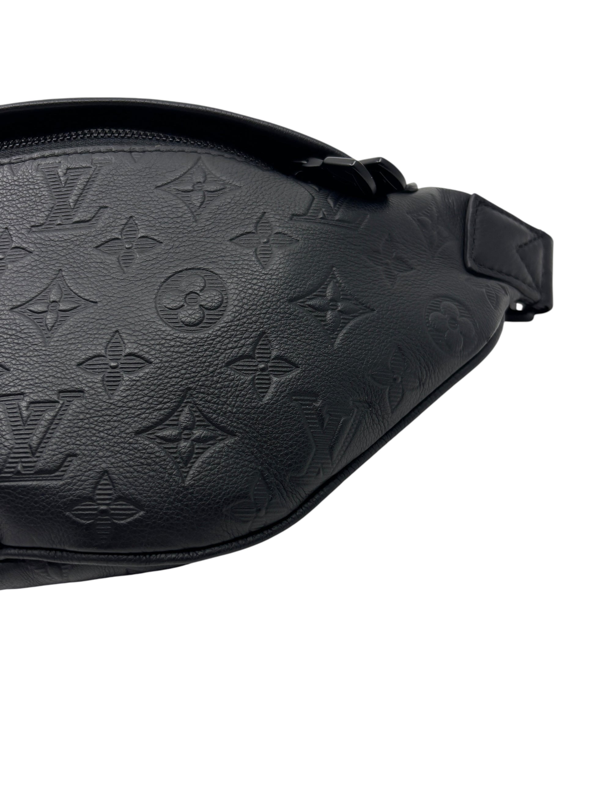 Posh Purse Co. black Louis Vuitton Empreinte leather bumbag with embossed monogram pattern and zipper detail.