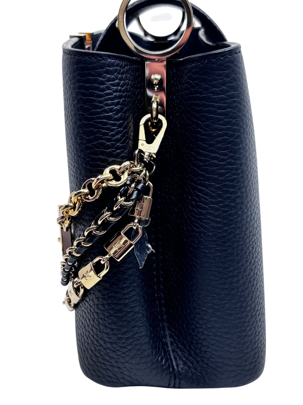 Posh Purse Co black leather Louis Vuitton Capucines BB handbag featuring a decorative gold and black chain detail