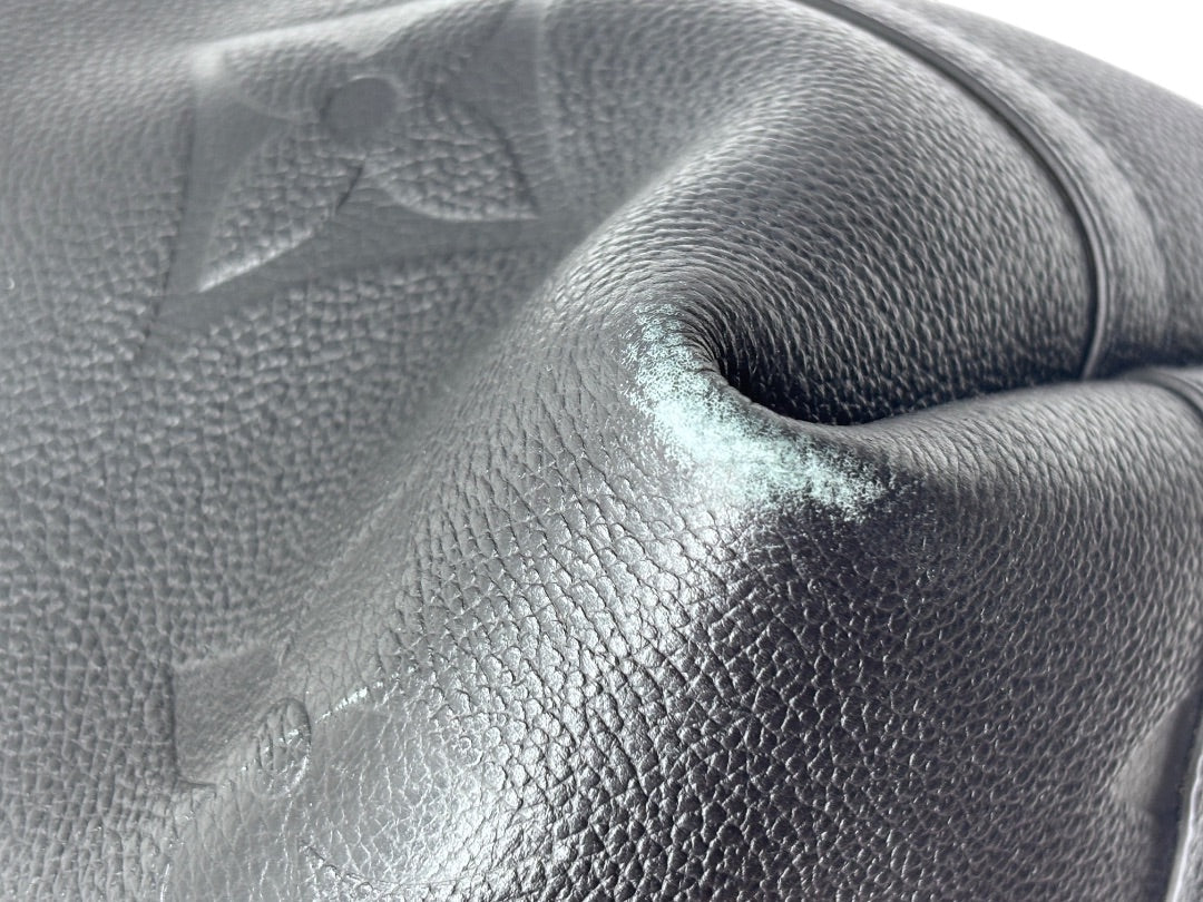 Posh Purse Co black Louis Vuitton CarryAll handbag showing minor corner wear on the textured leather exterior