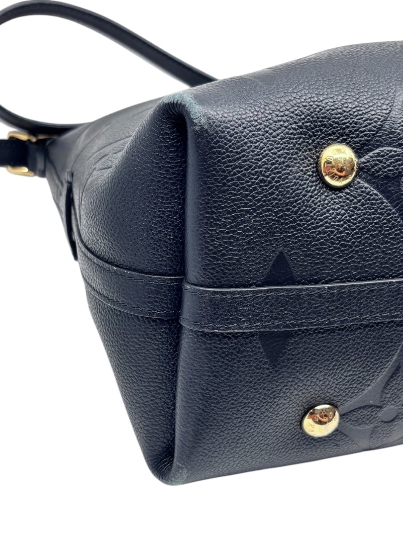 Posh Purse Co black Louis Vuitton CarryAll handbag showing textured leather exterior, gold hardware, and corner wear