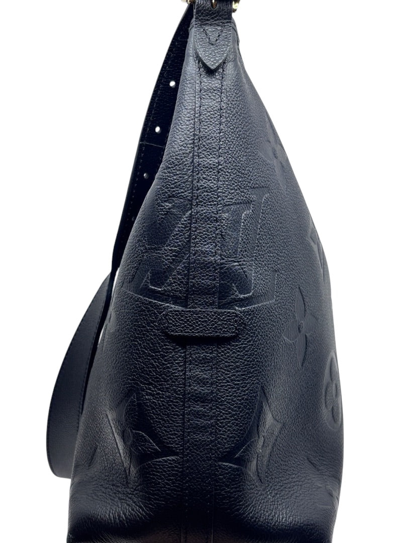 Posh Purse Co black Louis Vuitton CarryAll handbag featuring embossed monogram leather and a shoulder strap
