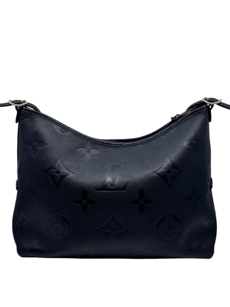 Posh Purse Co black Louis Vuitton CarryAll handbag featuring embossed monogram leather and gold-tone hardware