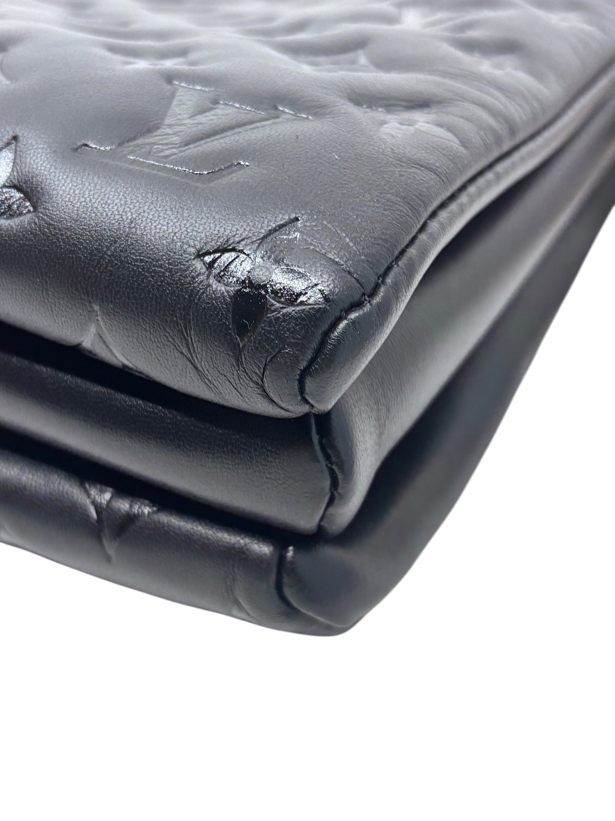 Posh Purse Co black Louis Vuitton Coussin bag featuring embossed monogram leather and soft structured silhouette