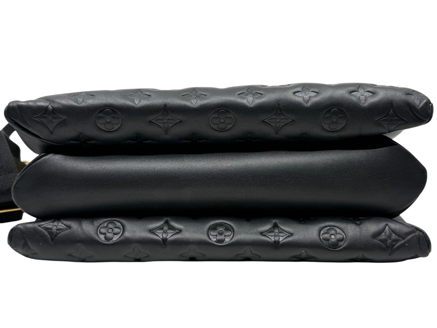 Posh Purse Co black Louis Vuitton Coussin MM bag showing the puffy embossed lambskin leather side profile