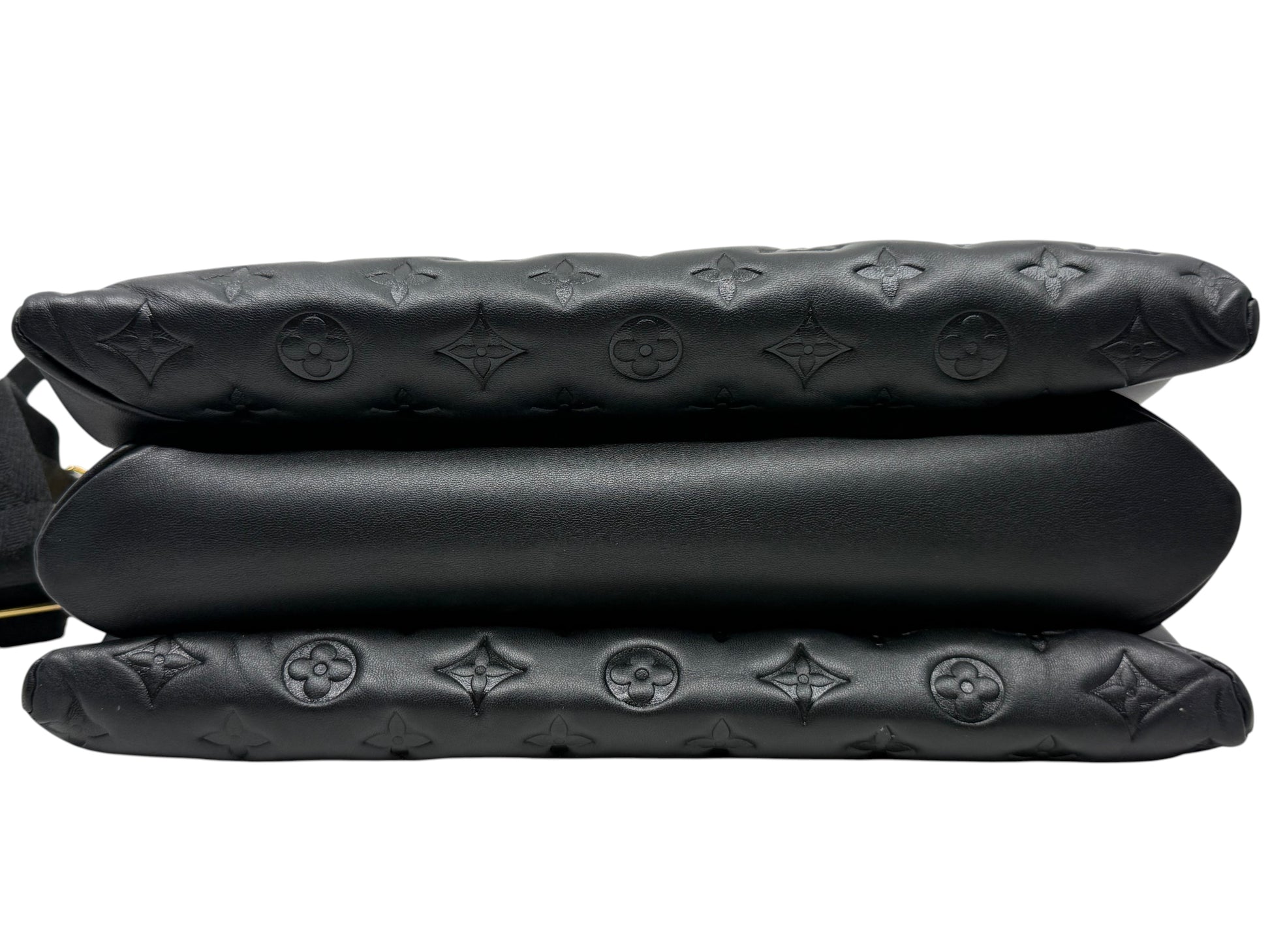 Posh Purse Co black Louis Vuitton Coussin MM bag showing the puffy embossed lambskin leather side profile