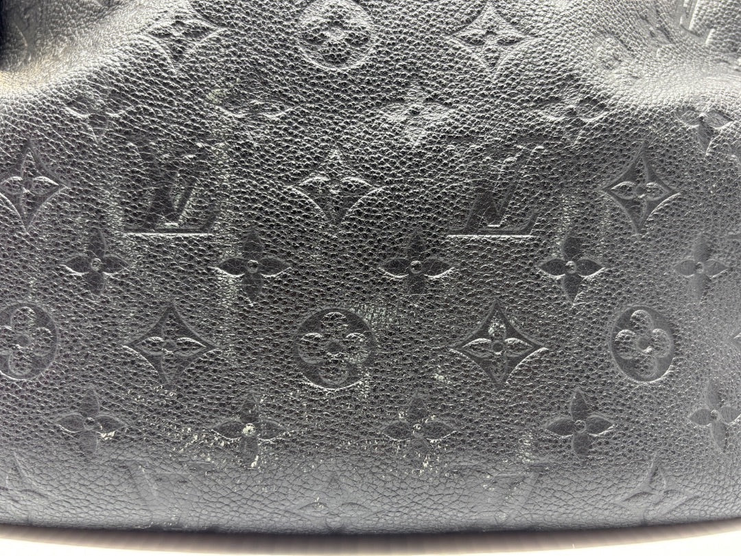 Black Louis Vuitton Monogram Empreinte leather with embossed pattern from Posh Purse Co.