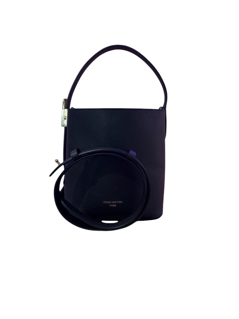 Posh Purse Co black Louis Vuitton Lowkey Carryall bucket bag with gold hardware and adjustable shoulder strap