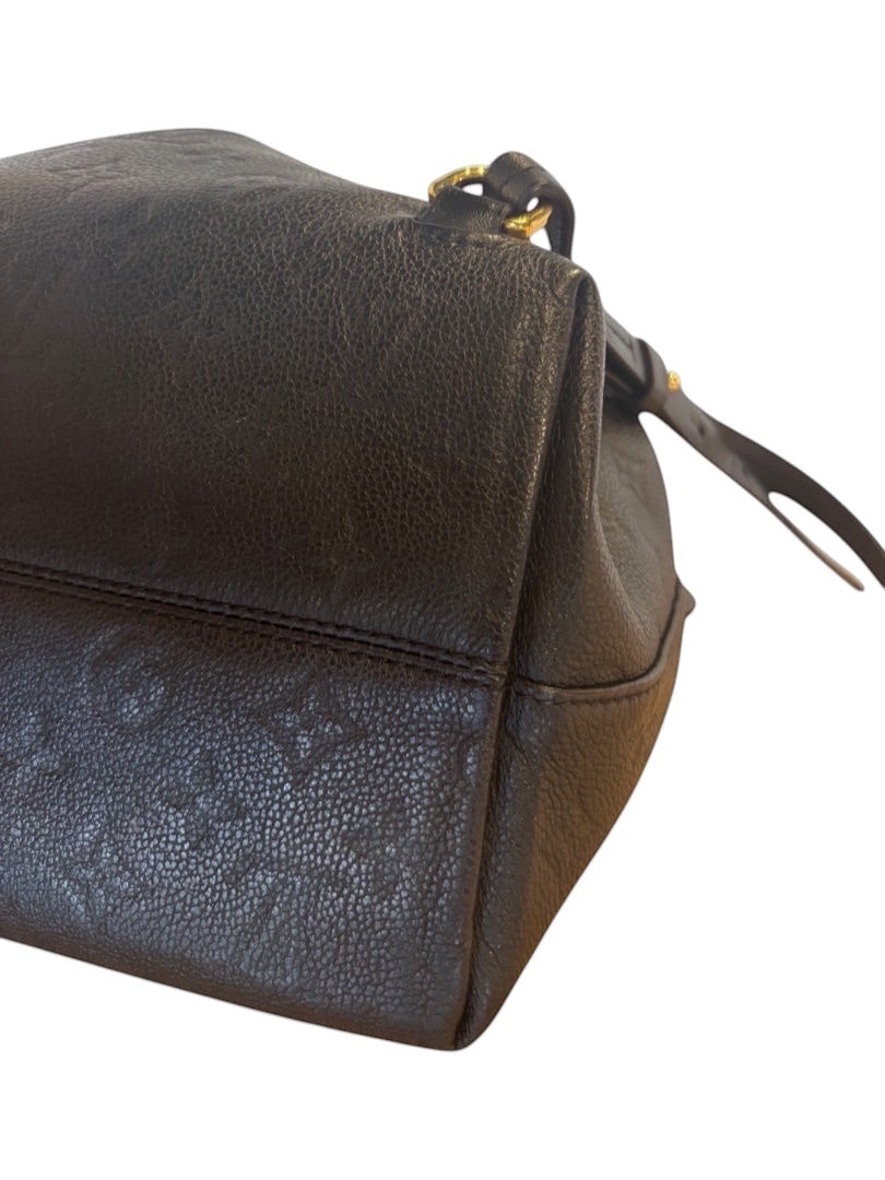 Posh Purse Co black Louis Vuitton Montsouris PM backpack in embossed Monogram Empreinte leather with gold-tone hardware.