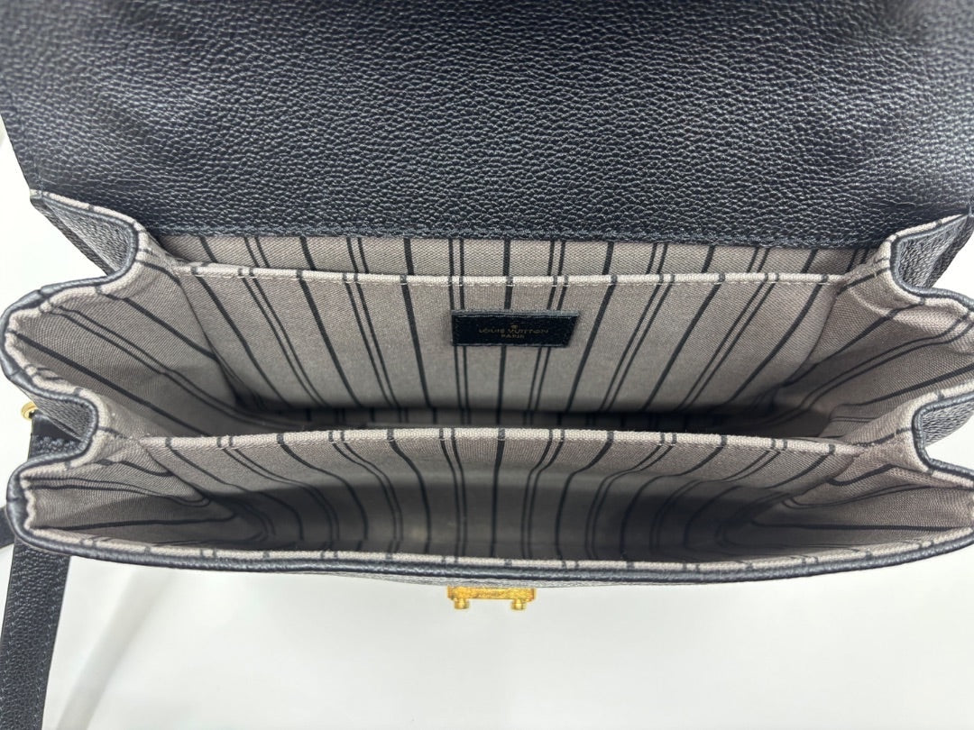 Posh Purse Co black Louis Vuitton Empreinte Pochette Metis handbag interior with striped lining and gold hardware.