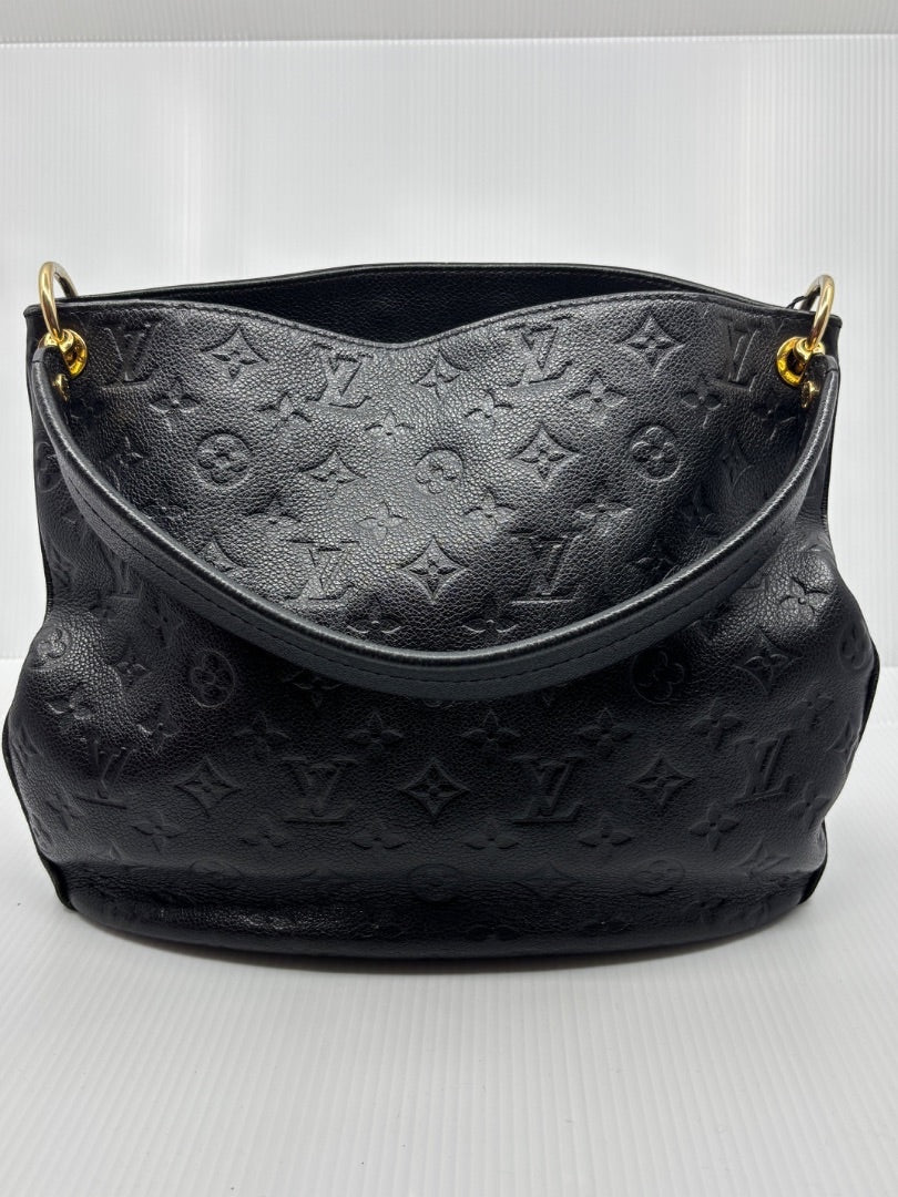Posh Purse Co. black Louis Vuitton Monogram Empreinte Spontini handbag with embossed leather and gold hardware.