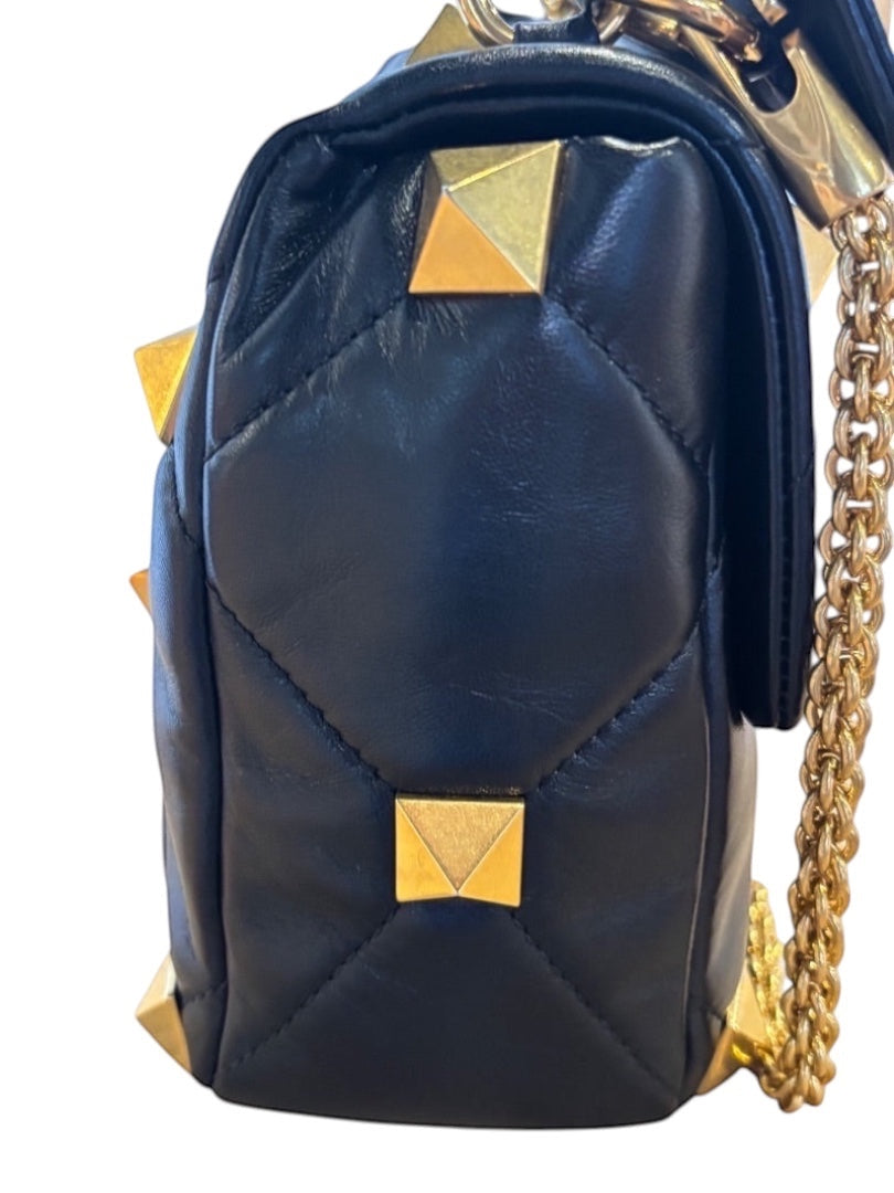 Posh Purse Co black nappa leather quilted handbag with gold Roman Stud hardware and chain strap.
