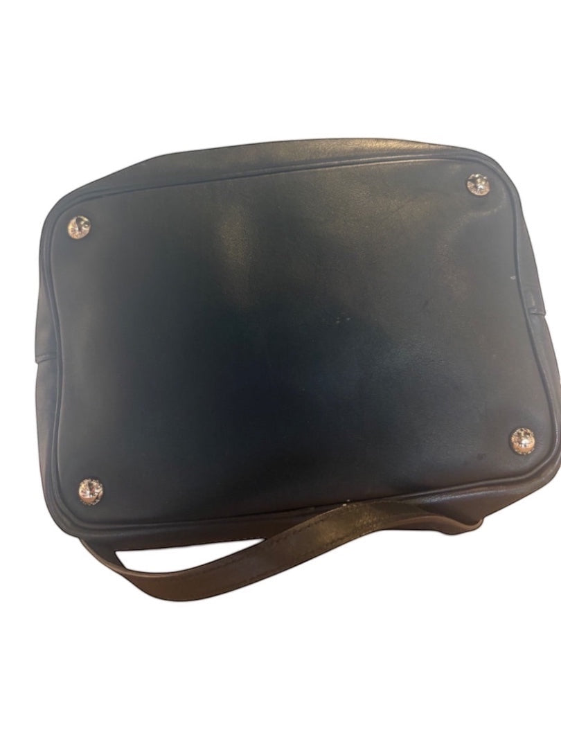 Posh Purse Co. black Prada leather bucket bag with silver hardware and a shoulder strap.