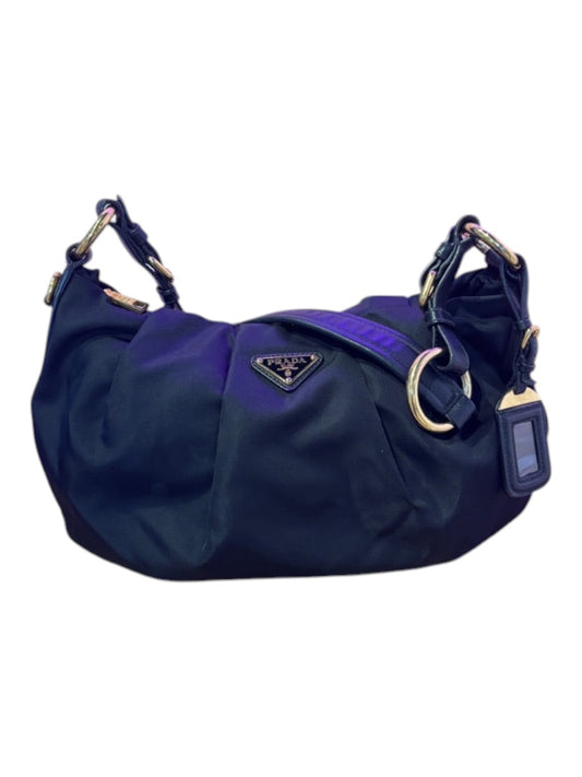 Posh Purse Co. black Prada nylon shoulder bag with gold hardware and triangle logo detail.