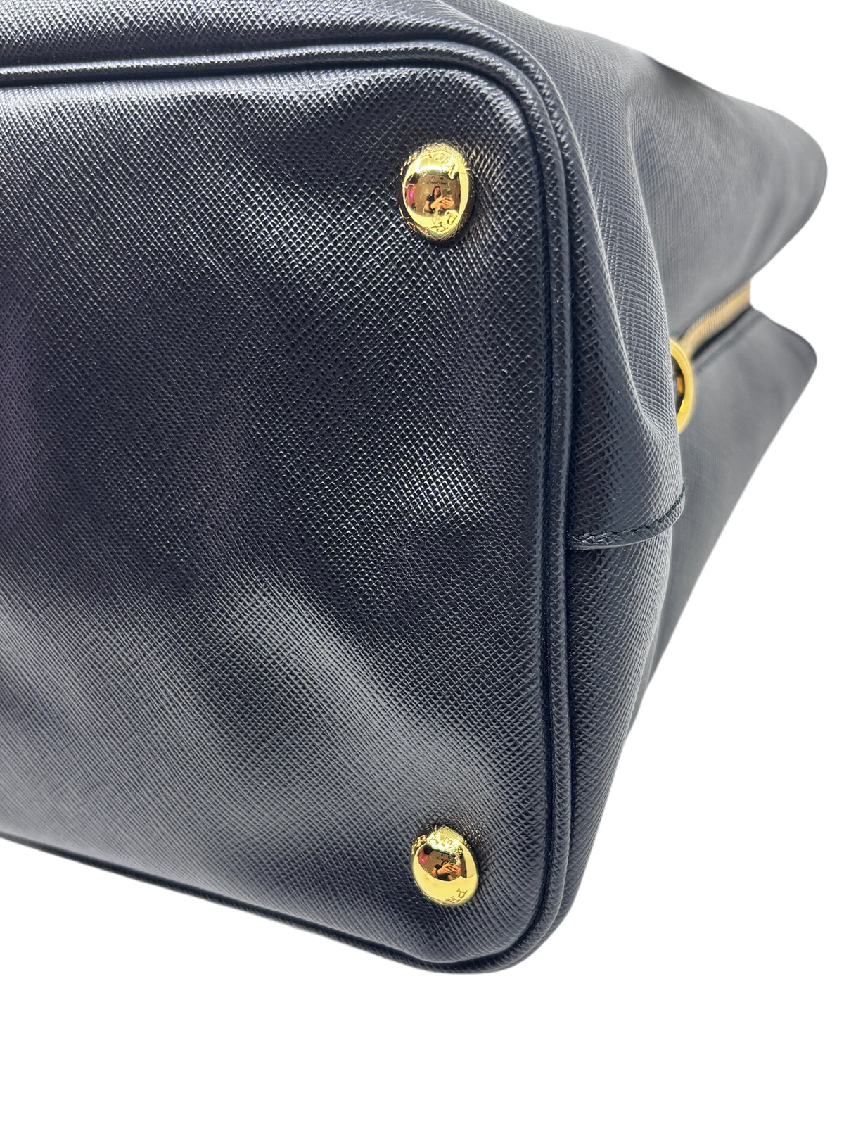 Posh Purse Co brand new black Prada Saffiano leather tote bag featuring gold protective feet on the base