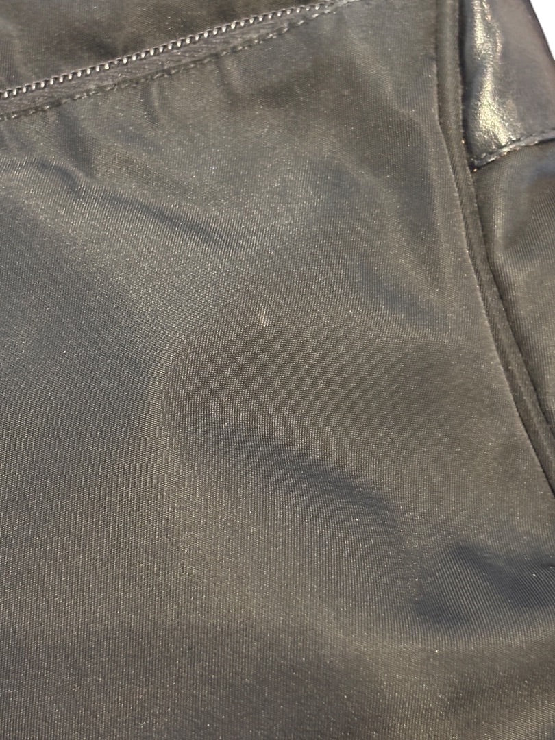 Posh Purse Co. black Prada Vela nylon messenger bag with zip closure and adjustable strap.