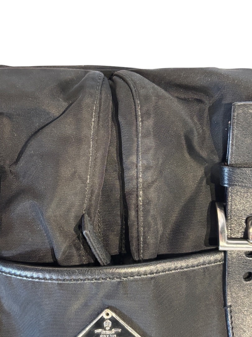 Posh Purse Co. black Prada Vela nylon messenger bag with leather trim and silver buckle detail.