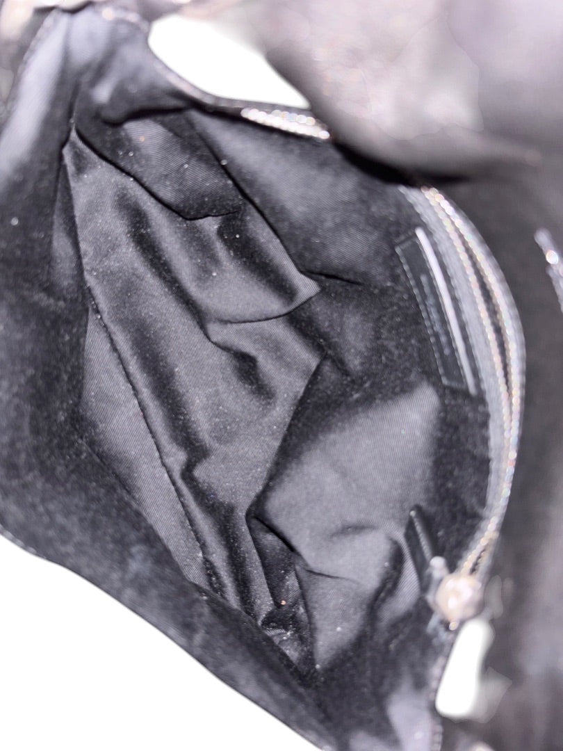 Posh Purse Co. black Saint Laurent Loulou Puffer bag interior with quilted lining and zipper detail.