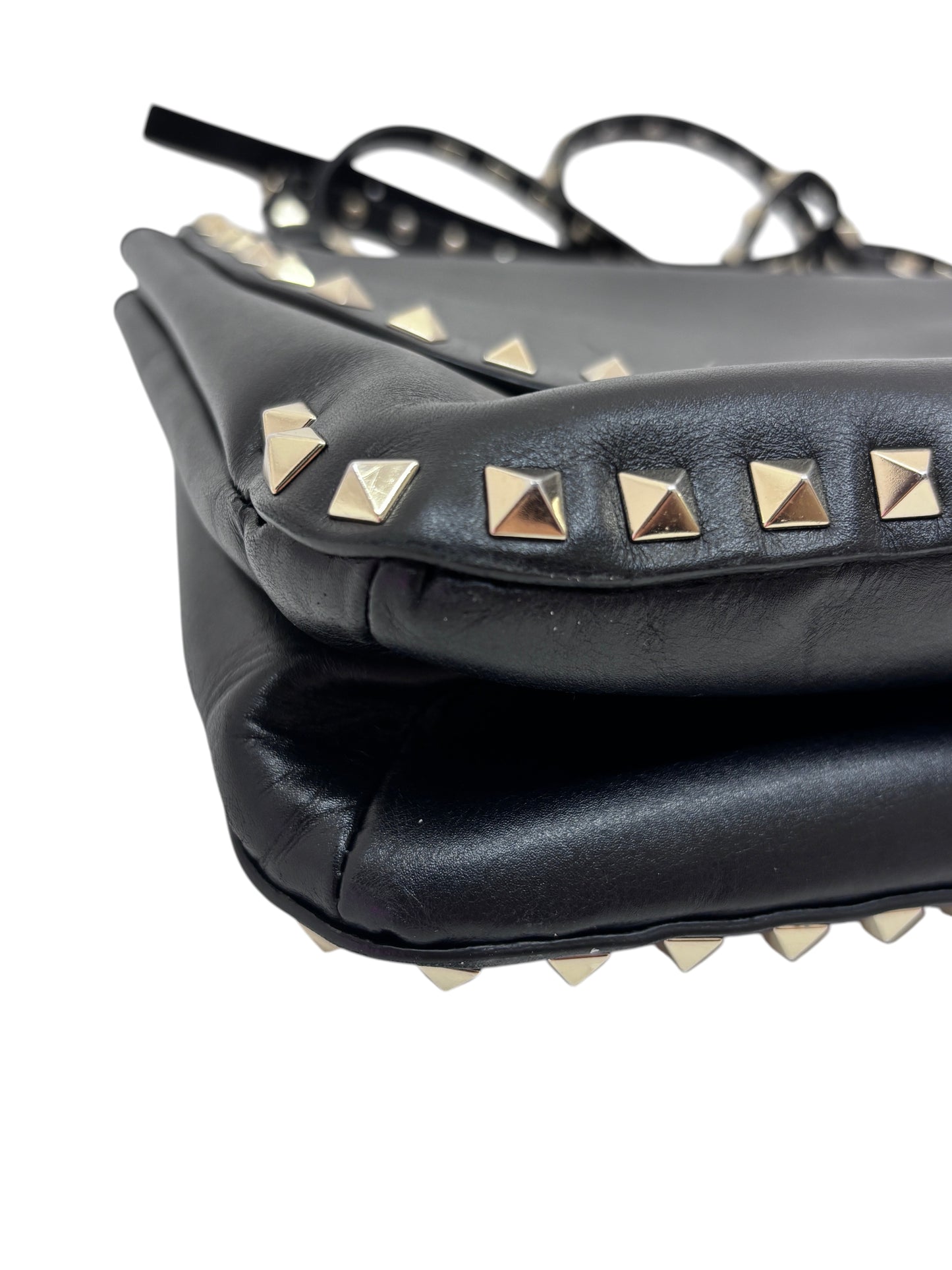 Posh Purse Co. black Valentino Rockstud flap bag featuring signature gold pyramid studs and smooth leather construction.