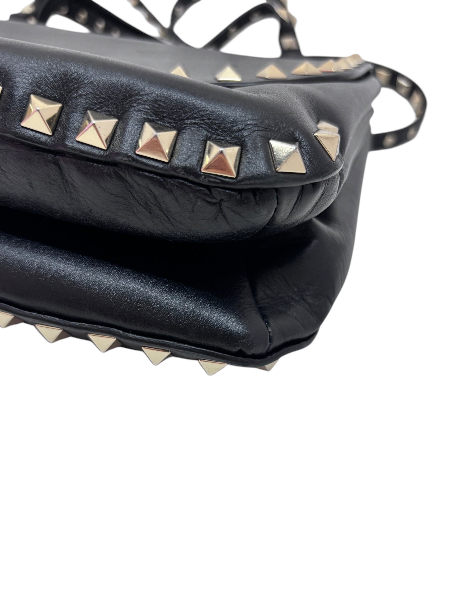 Posh Purse Co. black leather Valentino Rockstud bag with signature silver-tone pyramid stud detailing on the edges.