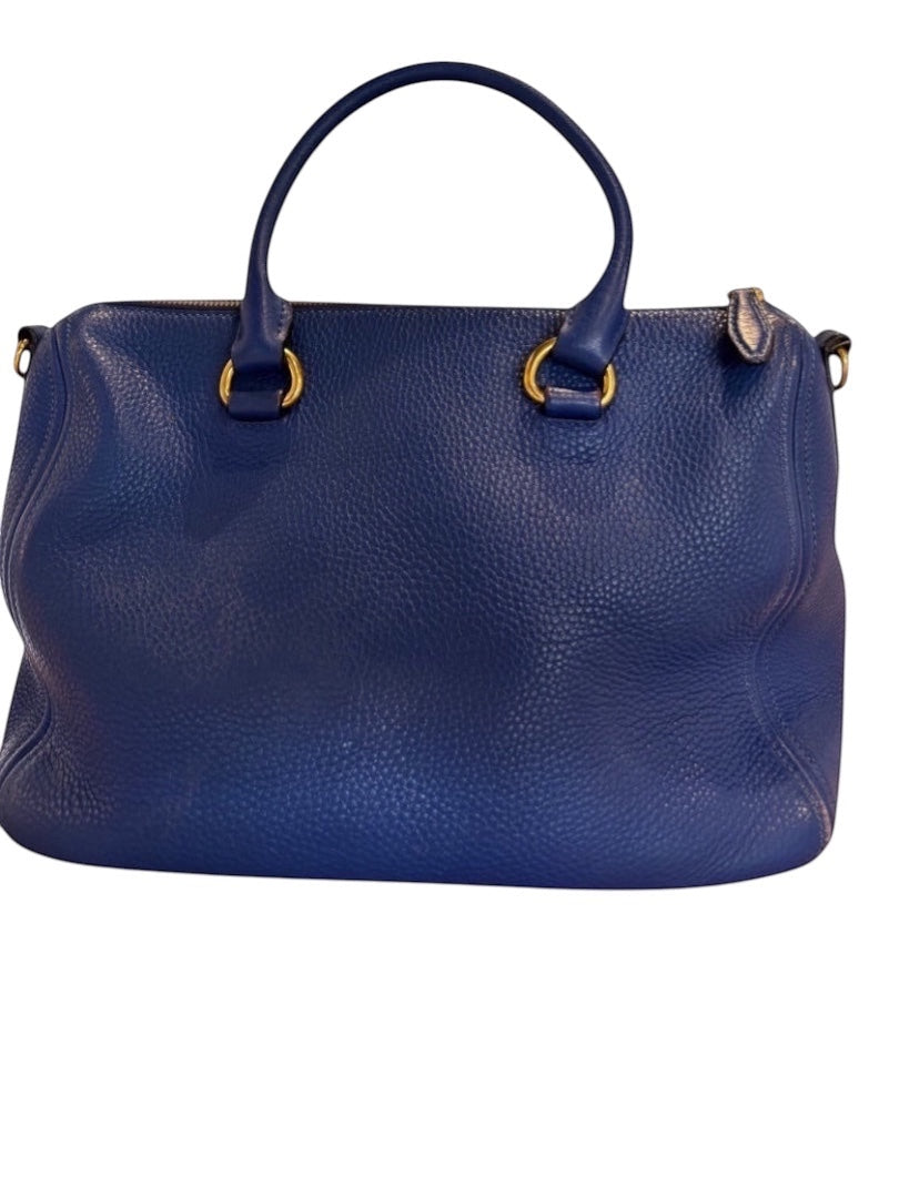 Posh Purse Co. blue Prada Vitello Daino leather handbag with gold hardware and dual handles.