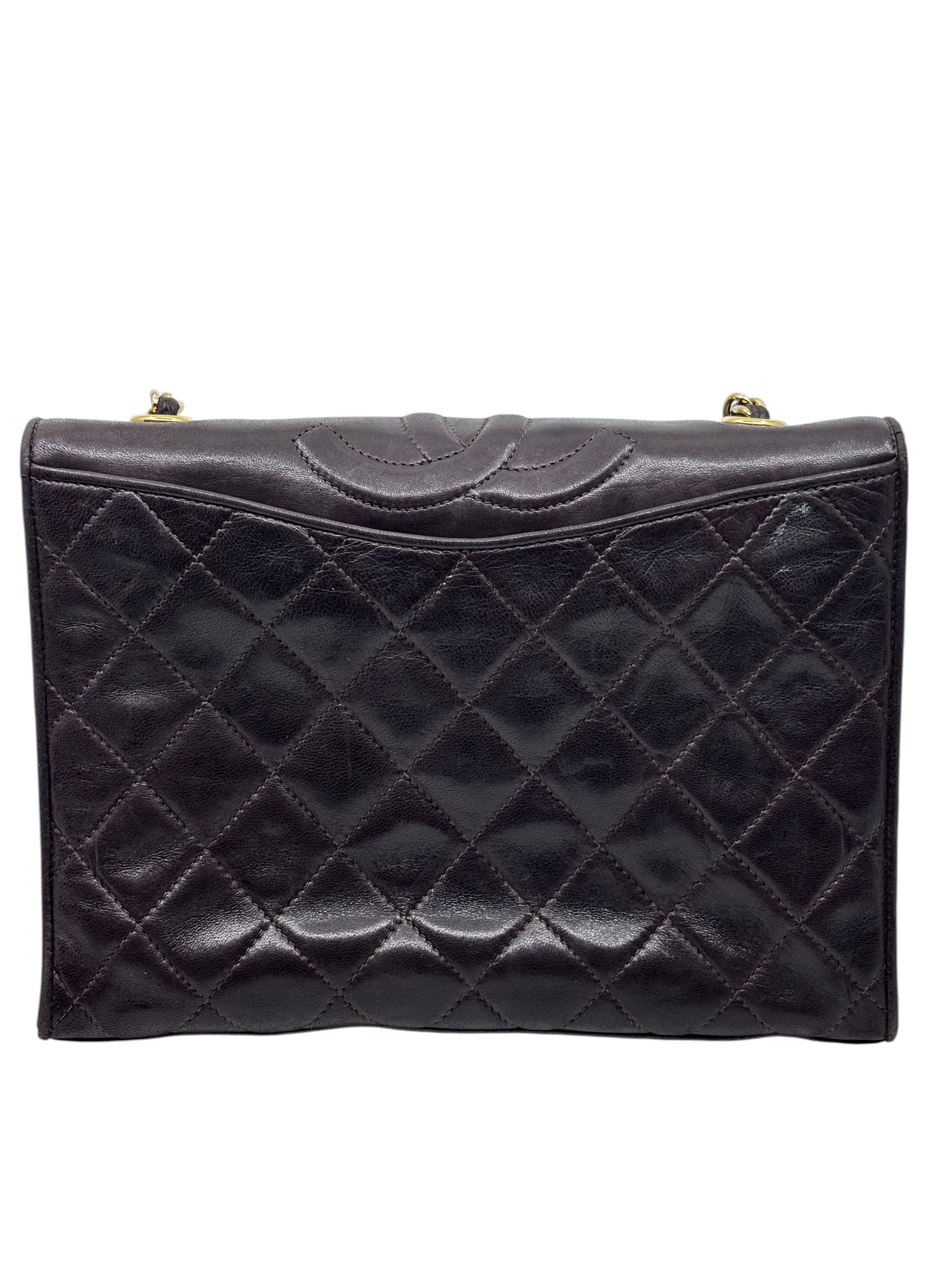 Posh Purse Co preloved brown quilted Chanel Timeless Flap crossbody bag with gold hardware and signature stitching.