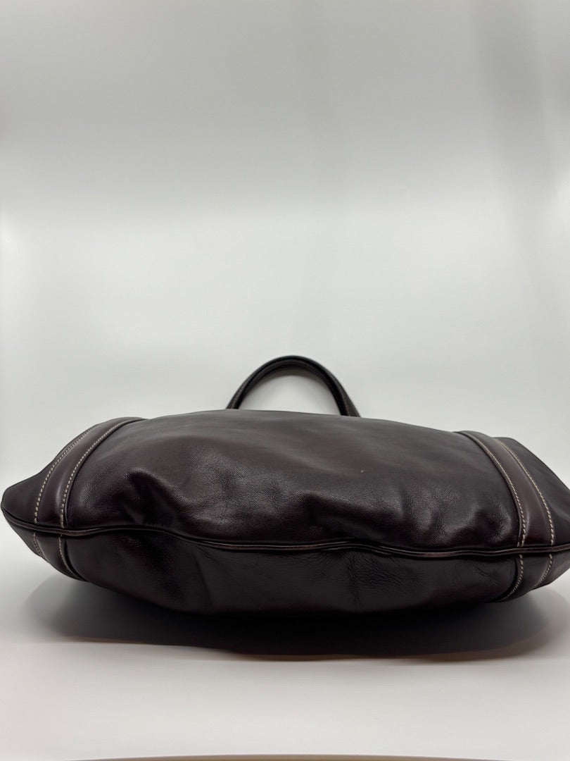 Posh Purse Co. brown leather Gucci GG tote bag with white stitching detail and double handles.