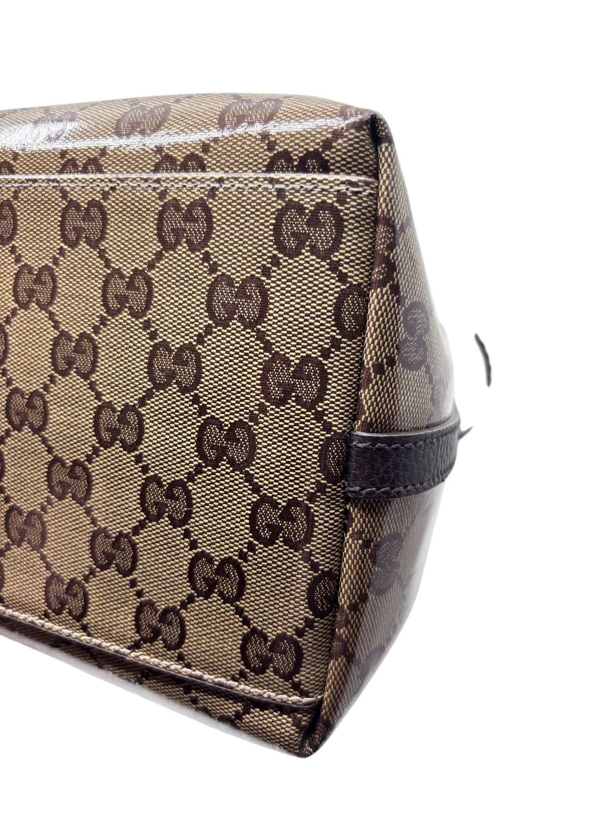 Close-up of Posh Purse Co. vintage Gucci Gifford tote featuring the iconic brown GG monogram canvas and leather trim.