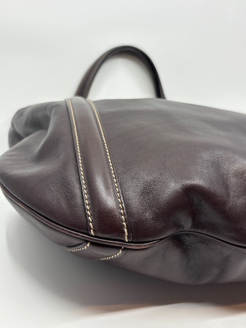 Posh Purse Co. brown leather tote bag with white contrast stitching and iconic GG logo.