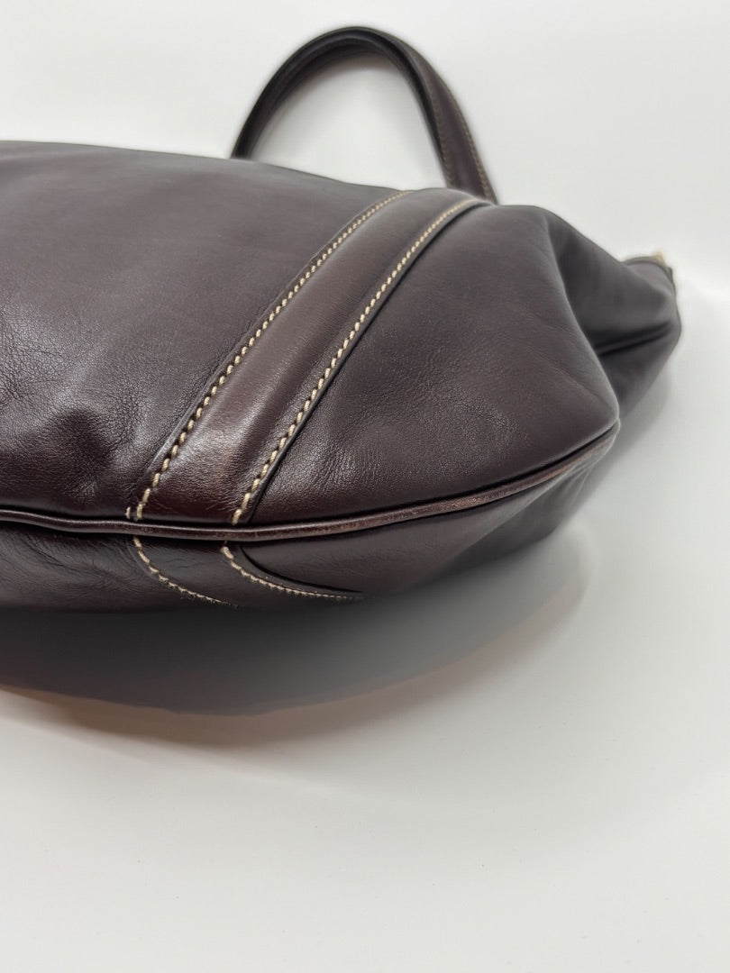 Posh Purse Co. brown leather tote bag with signature GG logo print and contrast stitching.