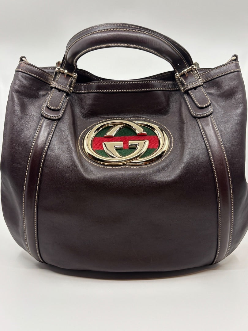Posh Purse Co. brown leather Gucci tote with iconic GG logo and red and green stripe detail. Double handles with buckle accents.