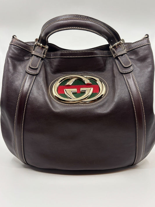 Posh Purse Co. brown leather Gucci tote with iconic GG logo and red and green stripe detail. Double handles with buckle accents.