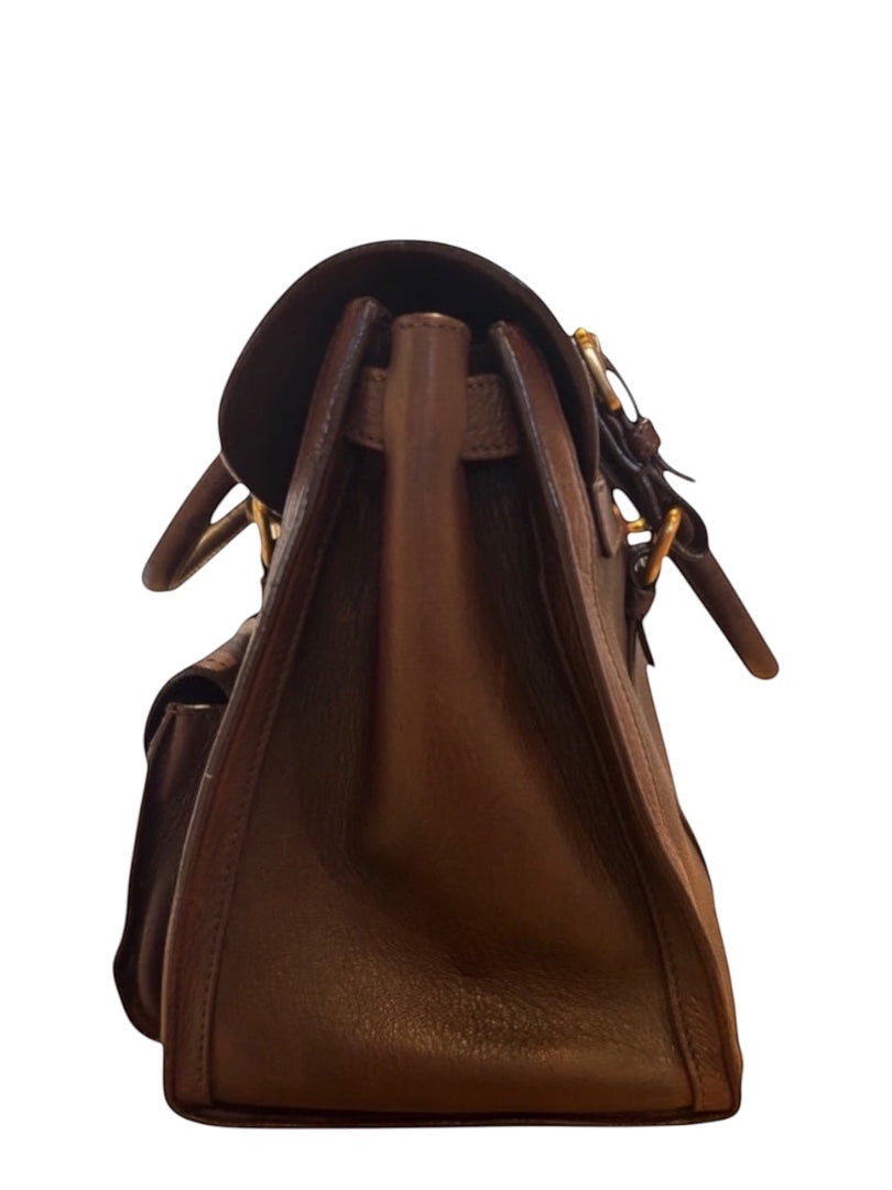 Posh Purse Co brown leather saddle tote handbag with gold hardware. Classic, versatile, and elegant.