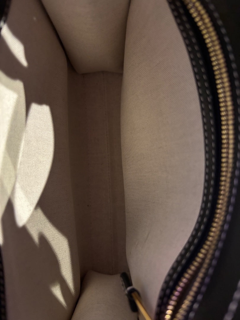 Posh Purse Co. Burberry black leather tote crossbody bag interior with beige lining and gold zipper.