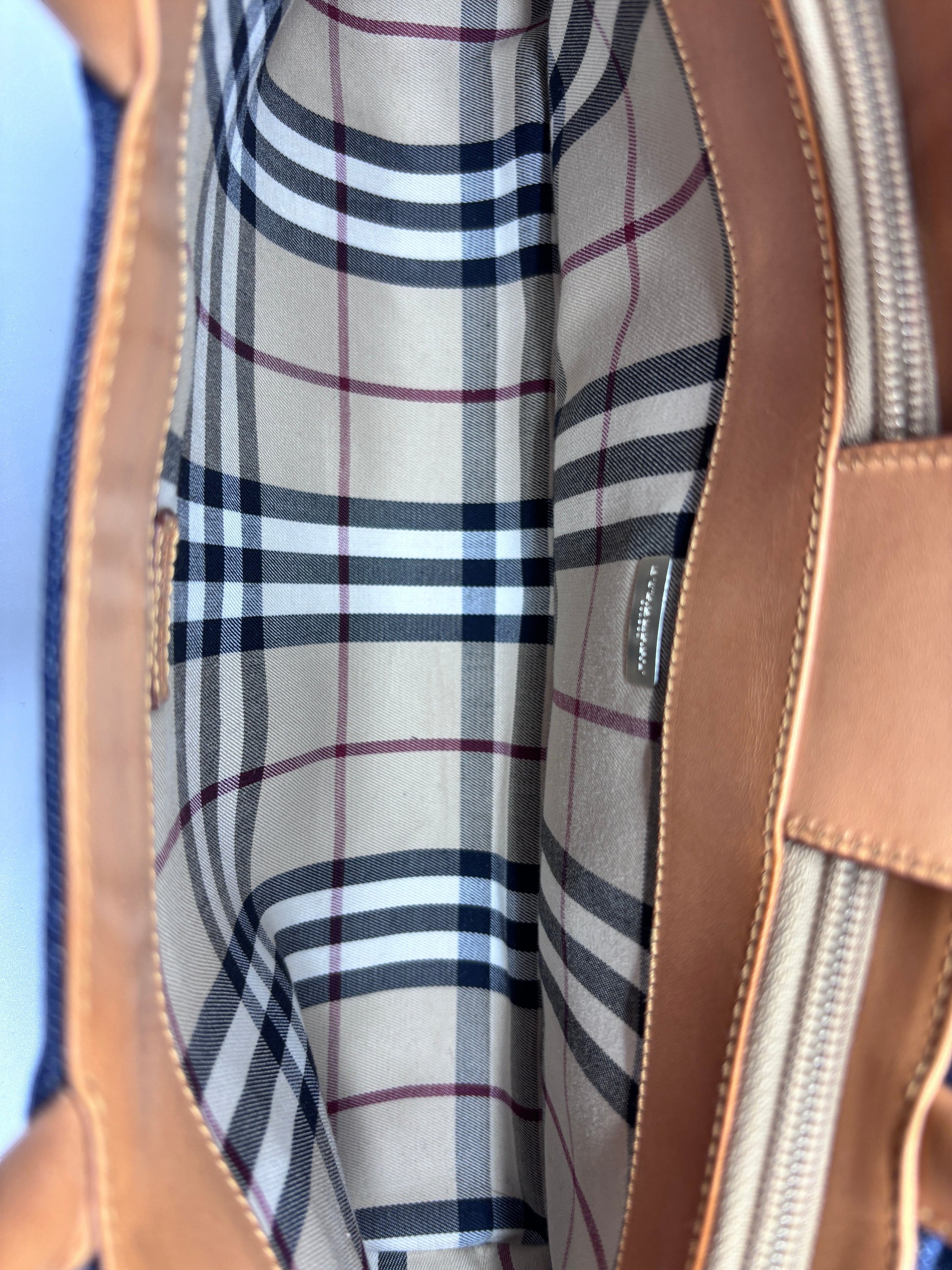 Posh Purse Co Burberry Nova Check denim tote interior featuring signature beige plaid lining and tan leather trim.