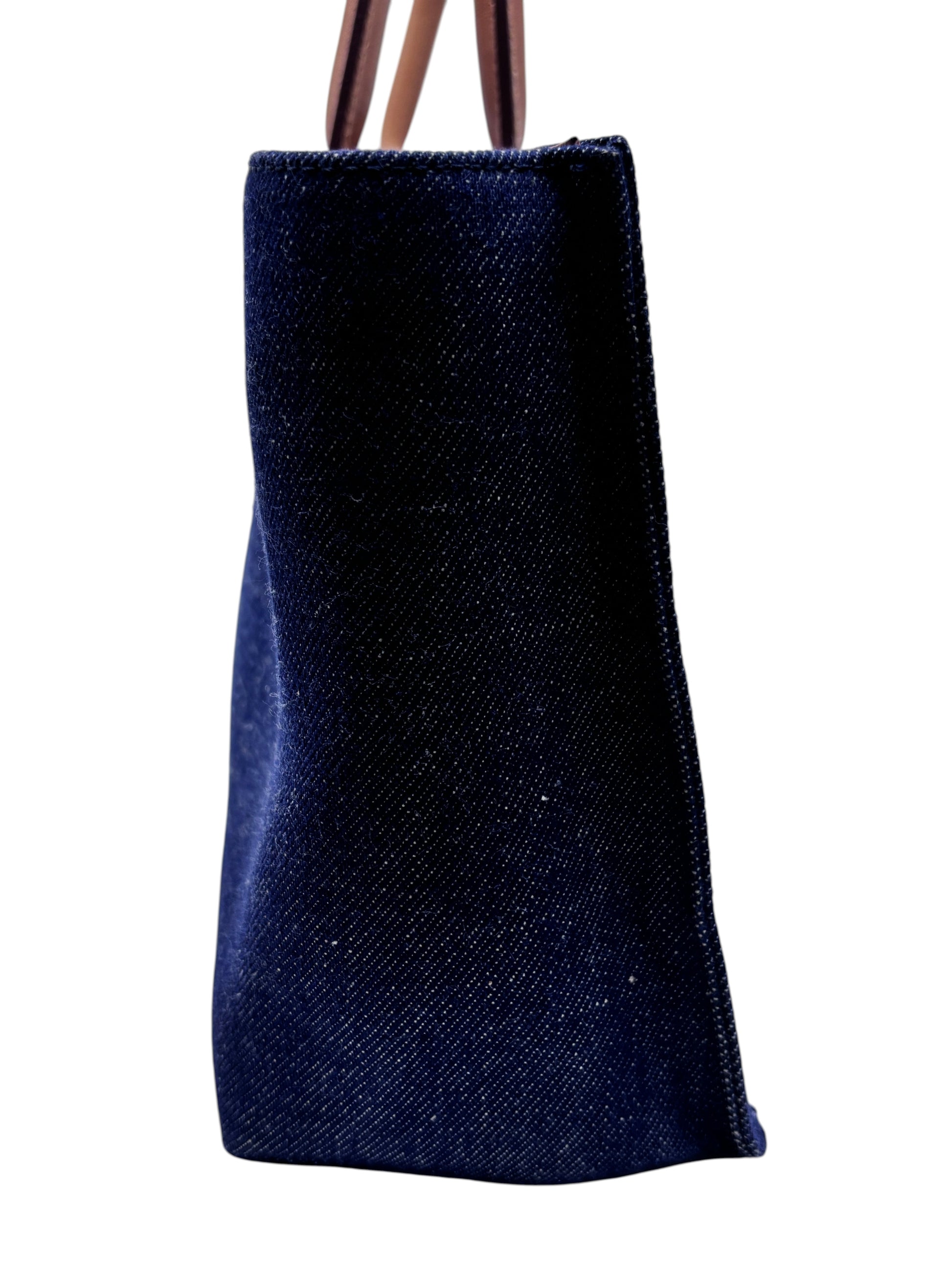 Posh Purse Co Burberry Nova Check denim tote bag side view showing dark blue fabric and leather handles