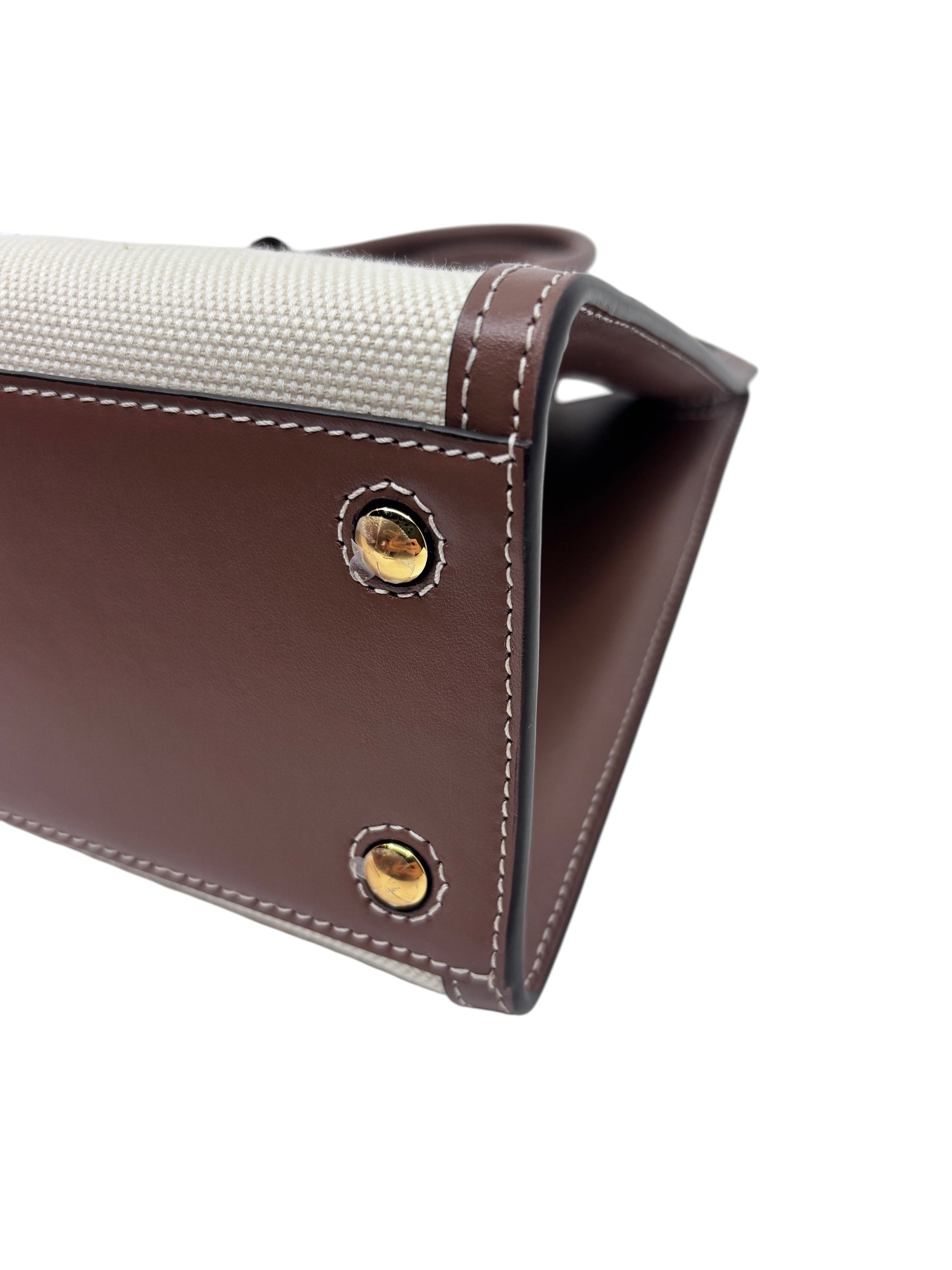 Posh Purse Co Burberry Mini Frances tote base detail featuring brown leather, cream canvas, and gold metal feet.