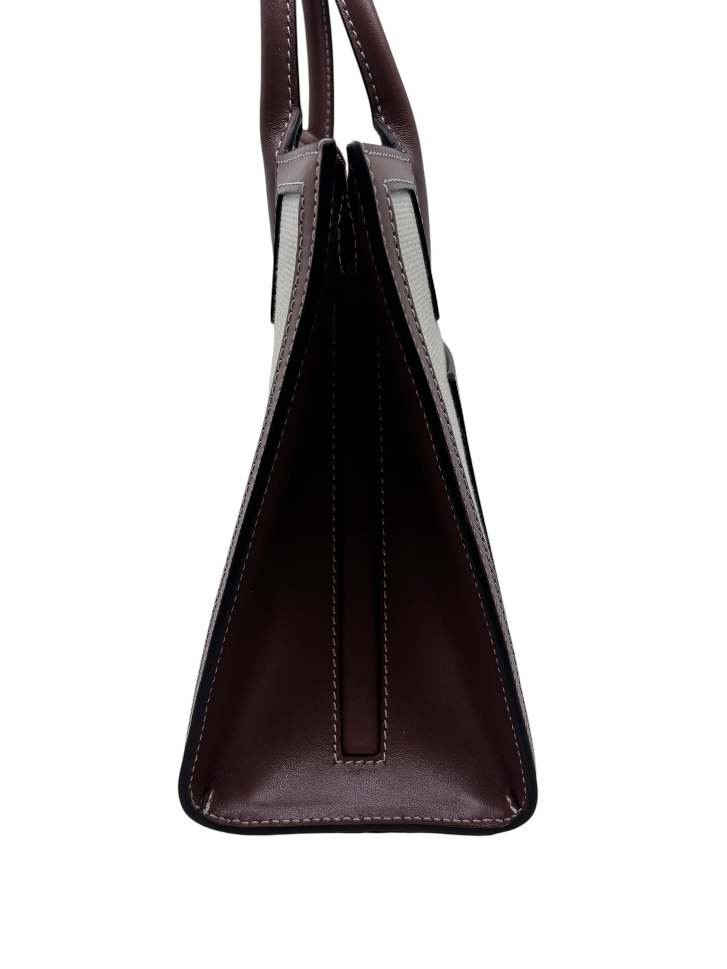 Side profile of a Posh Purse Co Burberry Mini Frances Tote in dark brown leather and canvas with structured design.