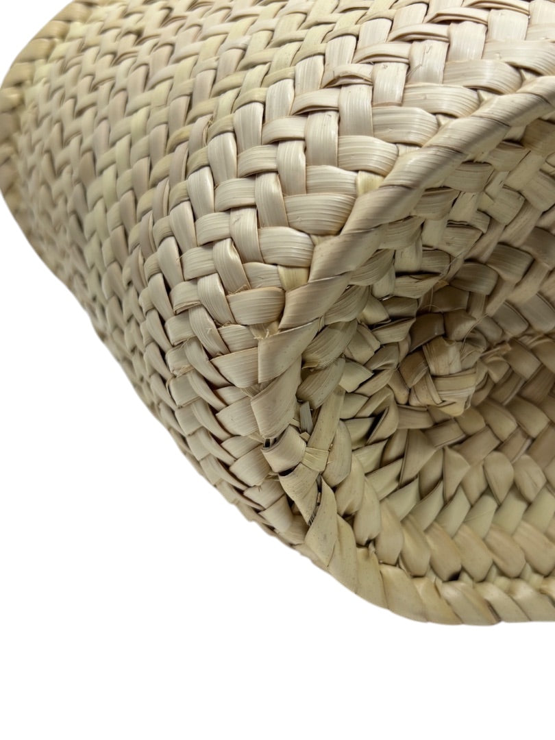 Close-up of the natural woven raffia texture on a Posh Purse Co. Celine Classic Panier bag base