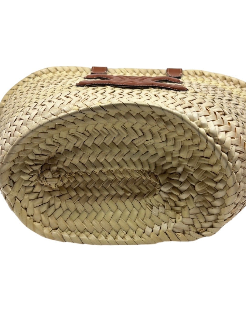 Posh Purse Co. Celine Classic Panier raffia tote bag showing the woven straw base and brown leather logo detail